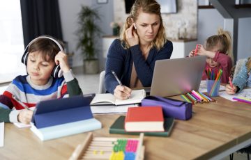 Busy mother during home office with children at home