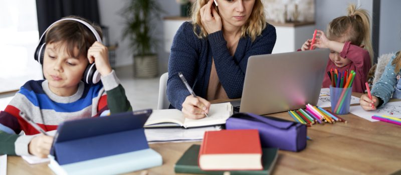 Busy mother during home office with children at home